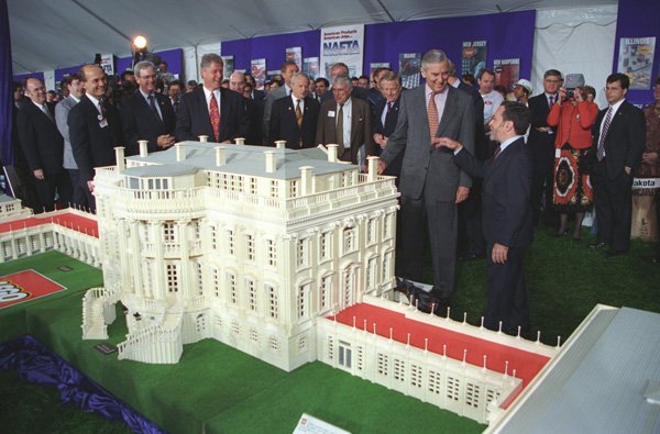 Photograph of President William J. Clinton Looking at a Lego Model of the White House at a North American Free Trade Agreement (NAFTA) Products Event