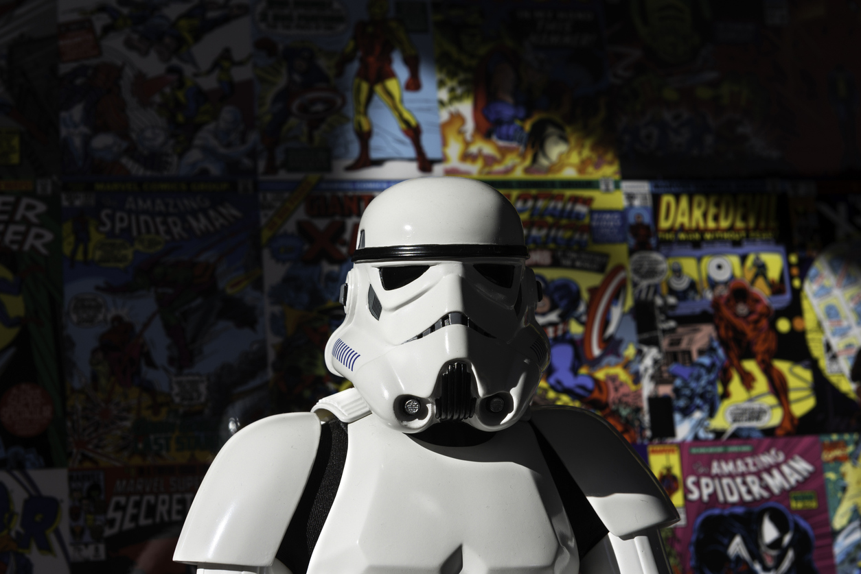 Star Wars white Imperial Stormtrooper action figure with comic books in the background